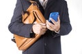 Business man with briefcase and using smart phone Royalty Free Stock Photo