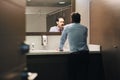 Business Man Brushing Teeth After Lunch Break In Office Bathroom Royalty Free Stock Photo