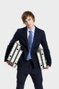 Business man carrying folders Royalty Free Stock Photo