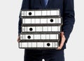 Business man carrying folders Royalty Free Stock Photo