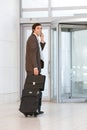 Business man carrying luggage Royalty Free Stock Photo