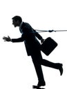 Business man catched by lasso rope silhouette