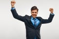 Business Man Celebrating Success against White Background