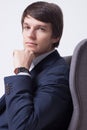 Business man on chair over white background