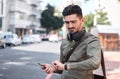 Business man, check watch and street with thinking, travel and waiting for transportation in metro cbd. Young