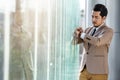 Business man checking time on smart watch in office Royalty Free Stock Photo