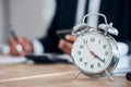 Business man, clock and time management in an office for deadline, punctual and busy schedule. Professional person or Royalty Free Stock Photo