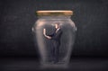 Business man closed into a glass jar concept