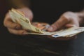 Business man counting money. rich male hands holds and count cash banknotes of 50 euros bills or notes currency. Royalty Free Stock Photo