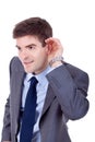 Business man cupping hand behind ear Royalty Free Stock Photo