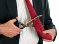 Business man cutting own tie - white background