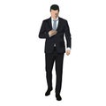 Business man in dark suit walking, typing sms Royalty Free Stock Photo