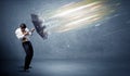 Business man defending light beams with umbrella concept Royalty Free Stock Photo