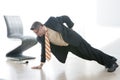 Business man Does One Armed Pushup Royalty Free Stock Photo