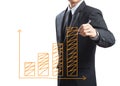 Business man drawing a growing graph Royalty Free Stock Photo