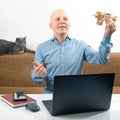 Business man dreams of his achievement. Business dream concept. A man holds a wooden airplane model in his hands Royalty Free Stock Photo