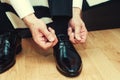 Business man dressing up with classic, elegant shoes. Groom wear Royalty Free Stock Photo