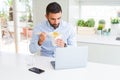 Business man eating asian food from delivery while working using computer laptop at the office Royalty Free Stock Photo