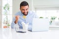 Business man eating asian food from delivery while working using computer laptop at the office Royalty Free Stock Photo