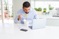 Business man eating asian food from delivery while working using computer laptop at the office Royalty Free Stock Photo