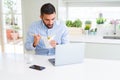 Business man eating asian food from delivery while working using computer laptop at the office Royalty Free Stock Photo