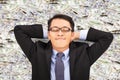 Business man enjoying and lying on the money Royalty Free Stock Photo