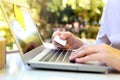 Business man entering data of a credit card . On-line shopping on the internet using a laptop Royalty Free Stock Photo