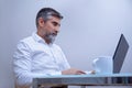 Business man executive sitting at desk using laptop Royalty Free Stock Photo