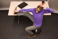 Business man exercising at desk at workplace Royalty Free Stock Photo