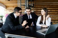 Business man explain his team all details of documents at office desk. Royalty Free Stock Photo