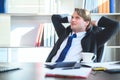 Business man feeling happy and relax working on laptop while sitting at his working place Royalty Free Stock Photo