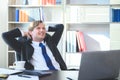 Business man feeling happy and relax working on laptop while sitting at his working place Royalty Free Stock Photo