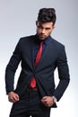 Business man fixes his suit jacket Royalty Free Stock Photo