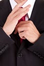 Business man fixing his tie Royalty Free Stock Photo