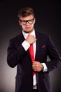 Business man fixing his tie Royalty Free Stock Photo