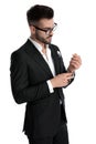 Business man fixing and looking at sleeve serious Royalty Free Stock Photo