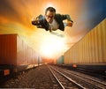 Business man flying and industry container trainst running on ra Royalty Free Stock Photo