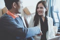 Business man gladly smile shaking hand with female partner