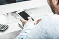 Business man on glass desk with phone Royalty Free Stock Photo