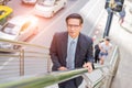 Business man going up the stairs in a rush hour to work. Hurry time