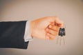 Business man hand holding keys Royalty Free Stock Photo