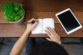 business man hand using laptop and write note inspire idea on wood Royalty Free Stock Photo