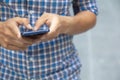 Business man hand using mobile smart phone. Close up mid section man well dressed holding phone typing text messaging. Phone Royalty Free Stock Photo