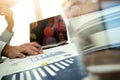 Business man hand working on laptop computer with business graph Royalty Free Stock Photo