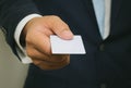 Business man handing a blank business card Royalty Free Stock Photo