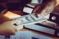 Business man handing money over a business dealing Royalty Free Stock Photo