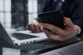 business man hands busy using cell phone at office desk Royalty Free Stock Photo