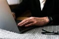 Business man hands busy using laptop at office desk, young male student typing on computer sitting at wooden table Royalty Free Stock Photo