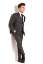 Business man with hands in pockets and legs crossed Royalty Free Stock Photo