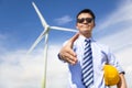 Business man handshake cooperate to do wind power fuel Royalty Free Stock Photo